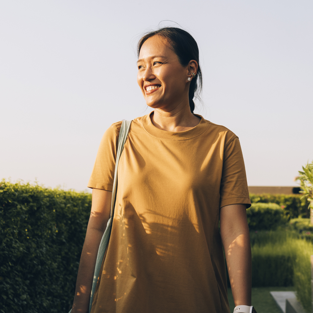 a person that is standing in the grass