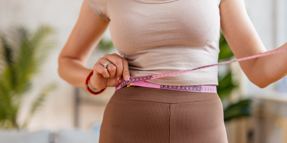a woman in a pink shirt